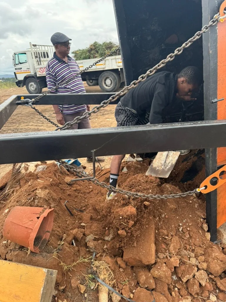Njia Yetu Skips mini skip on delivery trailer in Durban