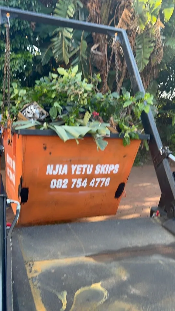 NJIA YETU SKIPS 2m³ skip loaded with garden refuse