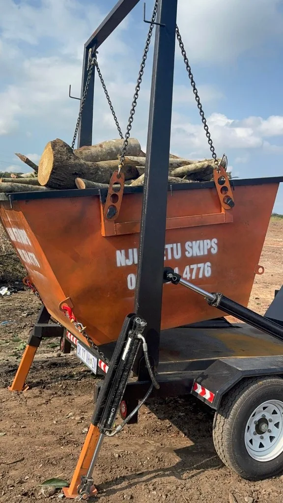 Building rubble loaded into a NJIA YETU SKIPS 2m³ mini skip
